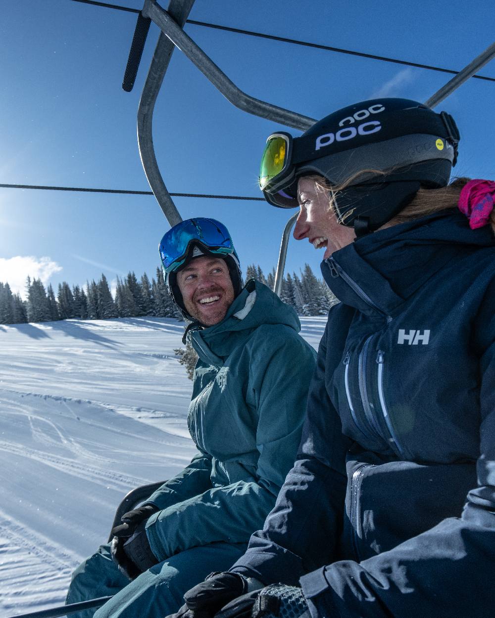 Navy Coloured Helly Hansen Womens Alphelia Lifaloft Ski Jacket on snow background