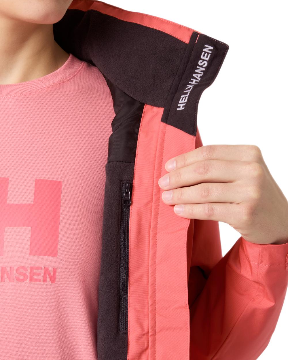Sunset Pink Coloured Helly Hansen Womens Crew Hooded Midlayer Sailing Jacket 2.0 On A White Background