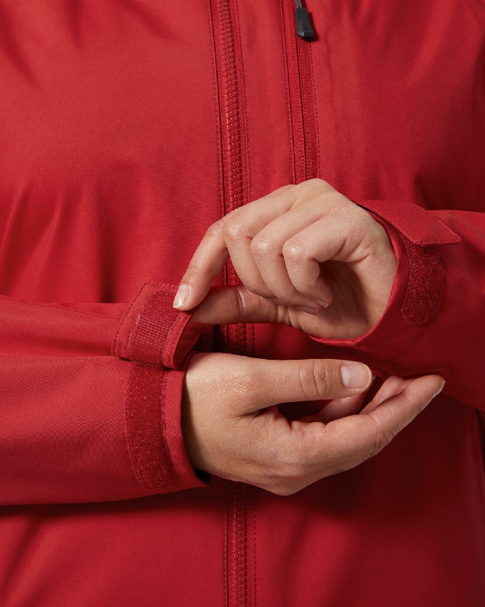 Red coloured Helly Hansen womens crew hooded sailing jacket 2.0 on white background