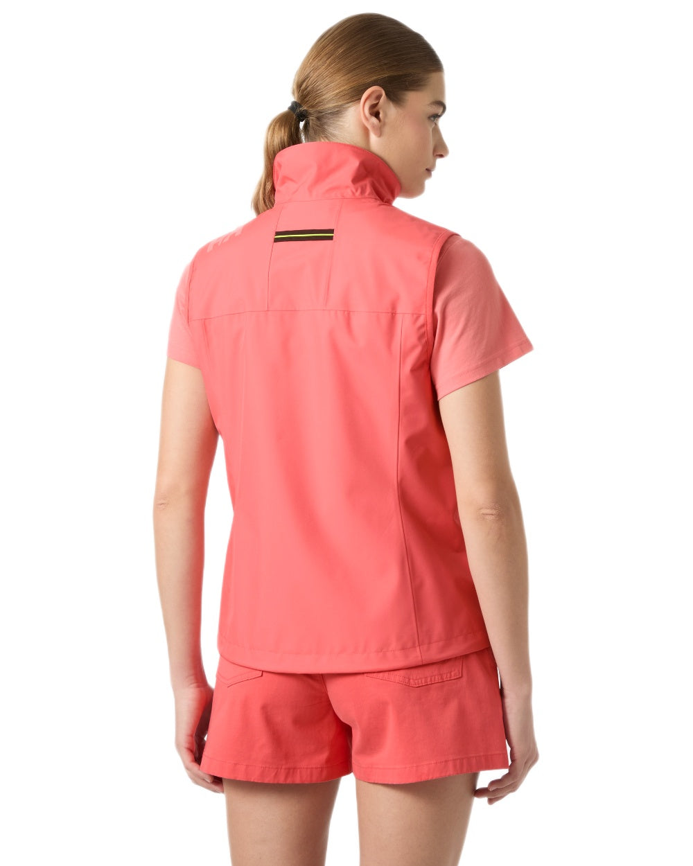 Sunset Pink coloured Helly Hansen Womens Crew Sailing Vest 2.0 on white background