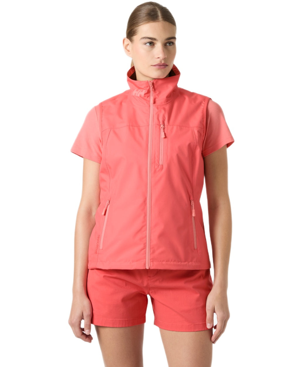 Sunset Pink coloured Helly Hansen Womens Crew Sailing Vest 2.0 on white background