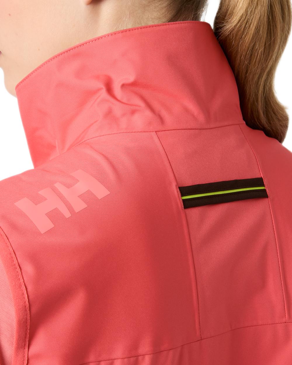 Sunset Pink coloured Helly Hansen Womens Crew Sailing Vest 2.0 on white background
