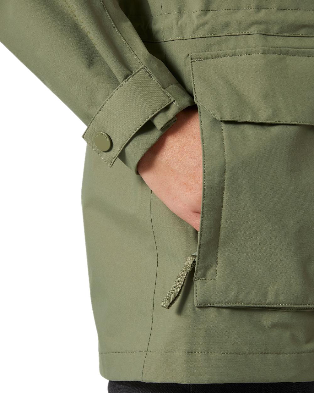 Lav Green coloured Helly Hansen Womens Escape Utility Raincoat on white background