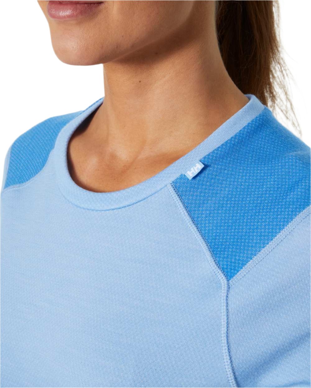 Bright Blue Coloured Helly Hansen Womens Lifa Merino Midweight Crew Base Layer on white background