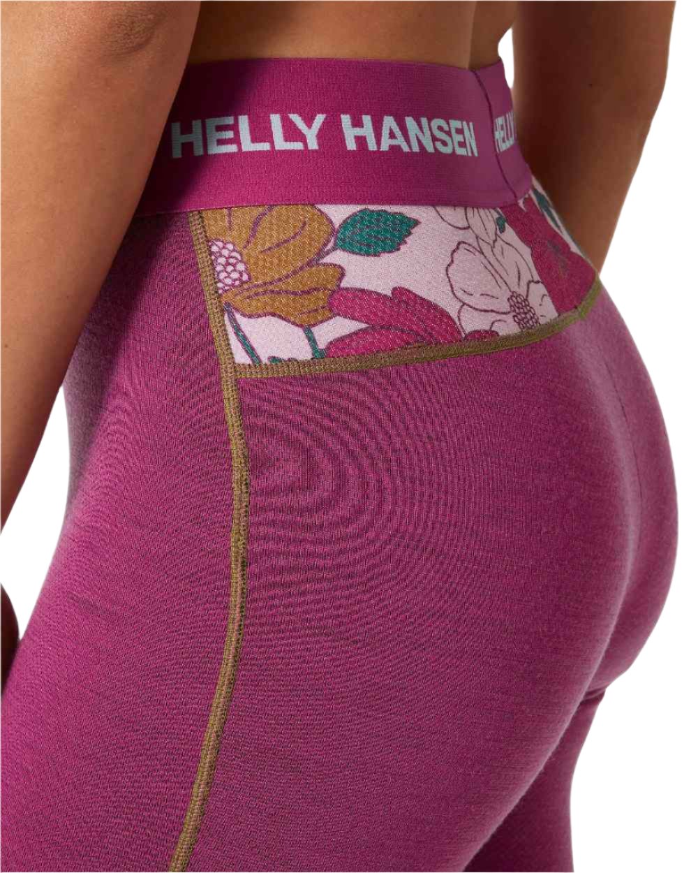 Magenta 2 Floral Aop Coloured Helly Hansen Womens Lifa Merino Midweight Graphic Base Layer Pants on white background