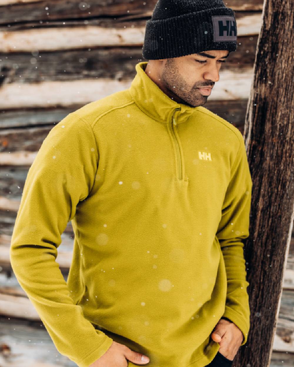 Olive Green coloured Helly Hansen Daybreaker 1/2 Zip Fleece on blurry background