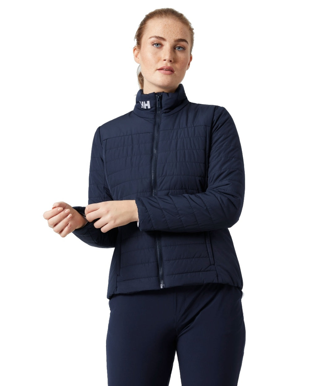Navy coloured Helly Hansen Womens Crew Insulated Sailing Jacket 2.0 on white background