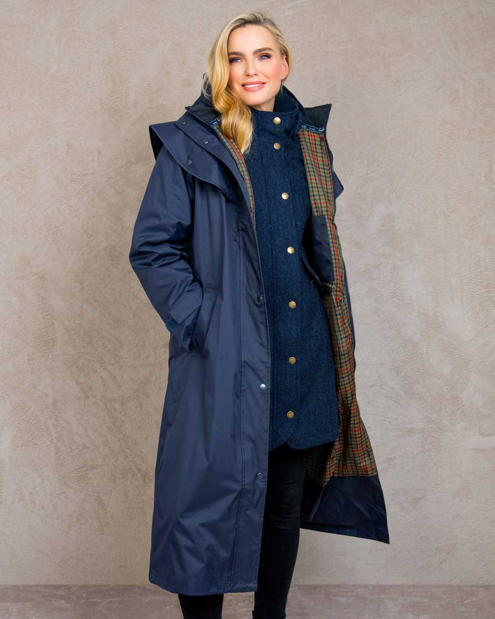 Heritage Navy coloured Jack Murphy Malvern Ladies Waterproof Bush Coat on wall background