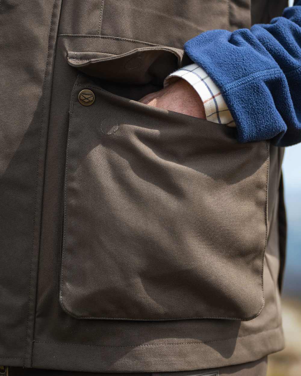 Green Coloured Hoggs of Fife Ballater Waterproof Field Waistcoat on outdoor background