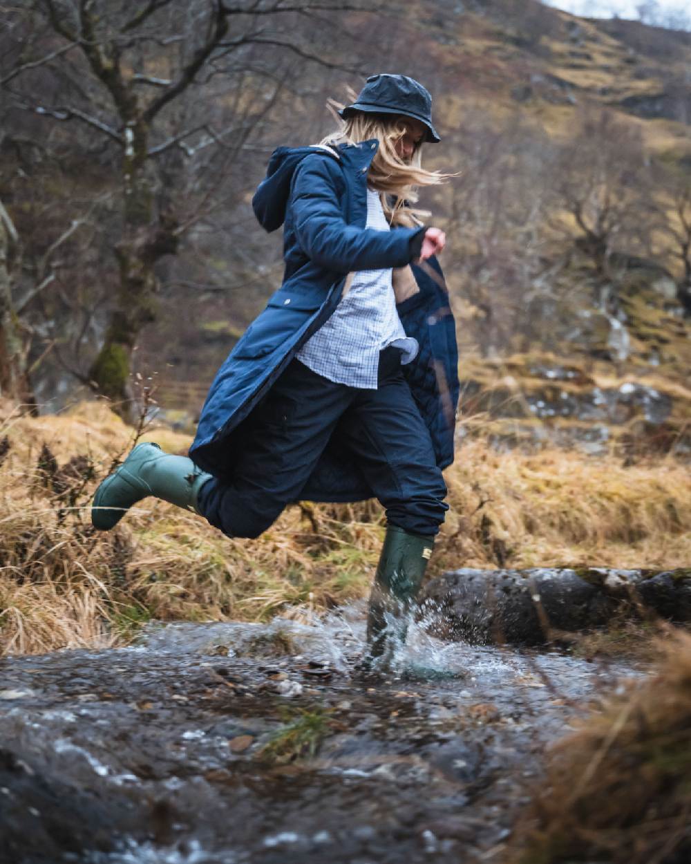 Green Coloured Hoggs of Fife Braemar Wellingtons on forest background