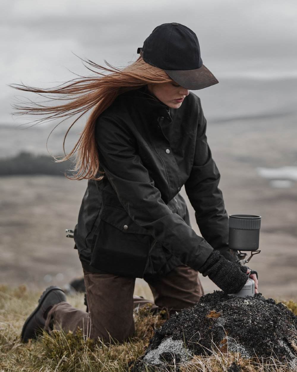 Antique Olive Coloured Hoggs of Fife Caledonia Ladies Antique Wax Jacket on blurry background