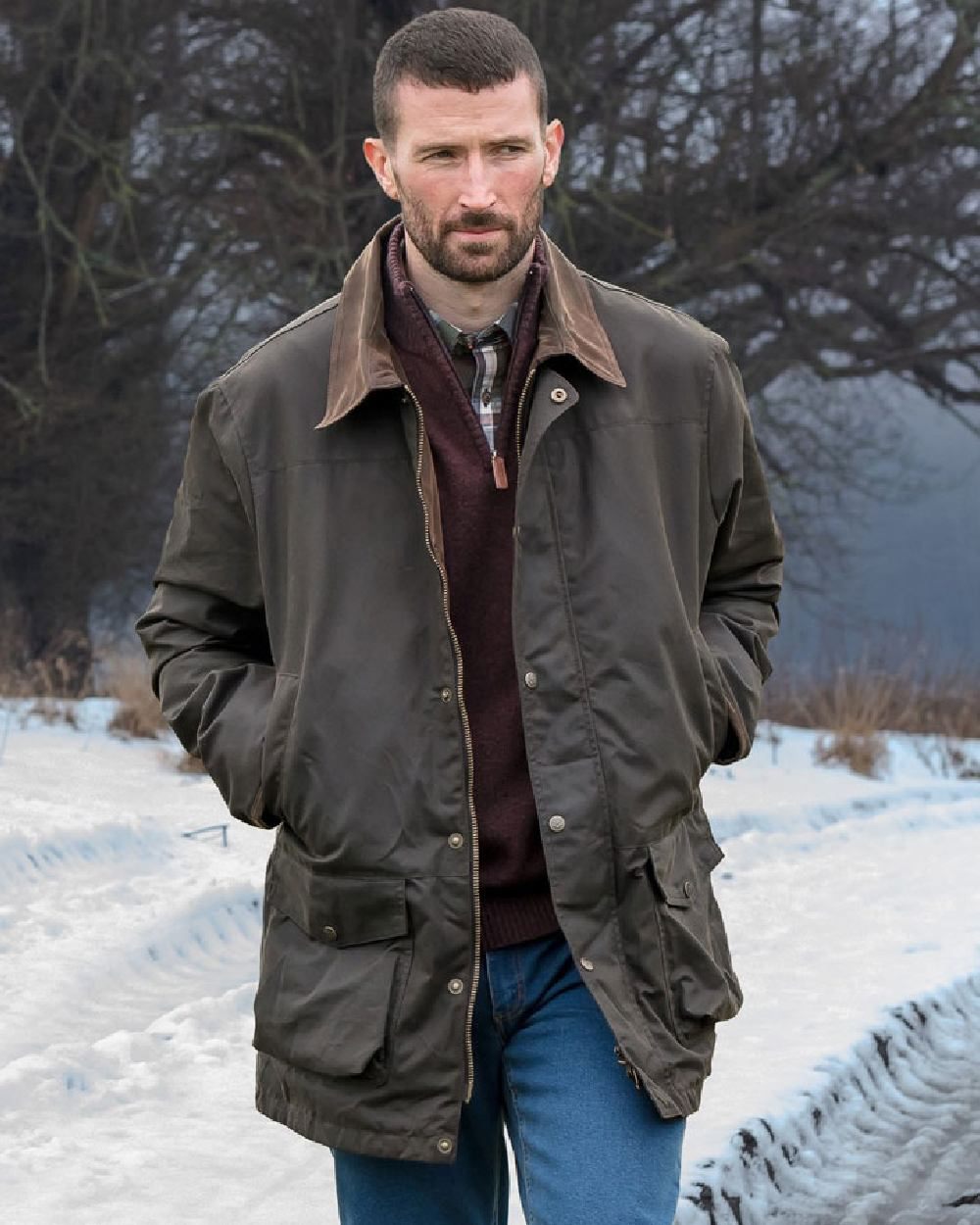 Olive Coloured Hoggs of Fife Caledonia Waxed Jacket on snow background