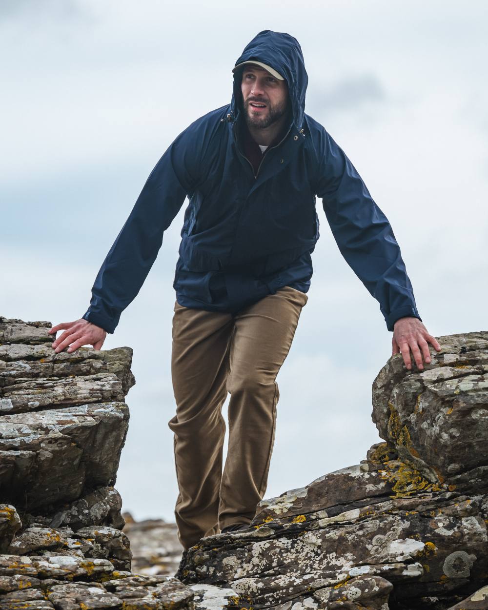 Navy Coloured Hoggs of Fife Culloden Waterproof Field Jacket on sky background
