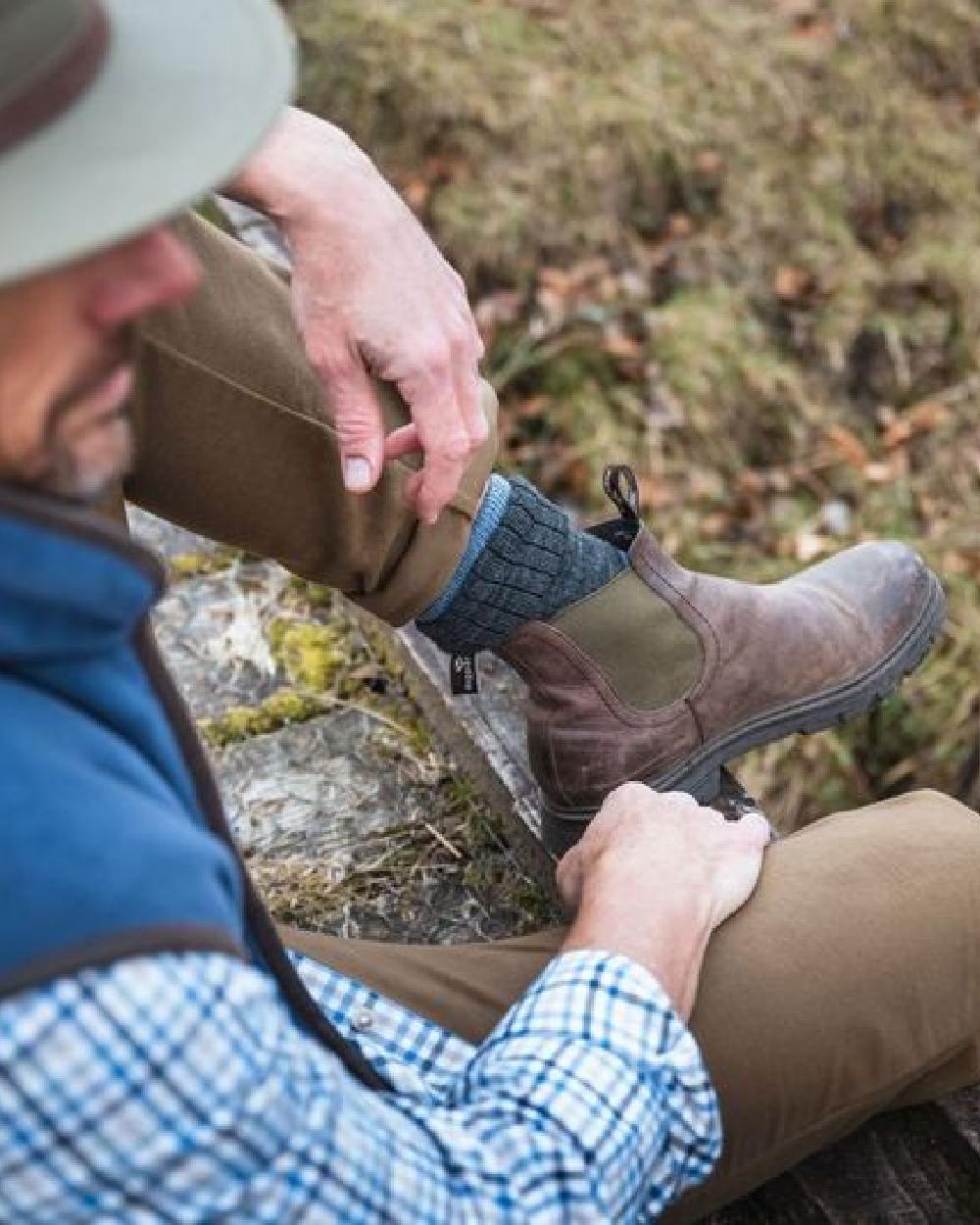Dark Brown Coloured Hoggs of Fife Dalmeny Dealer Boots on blurry background