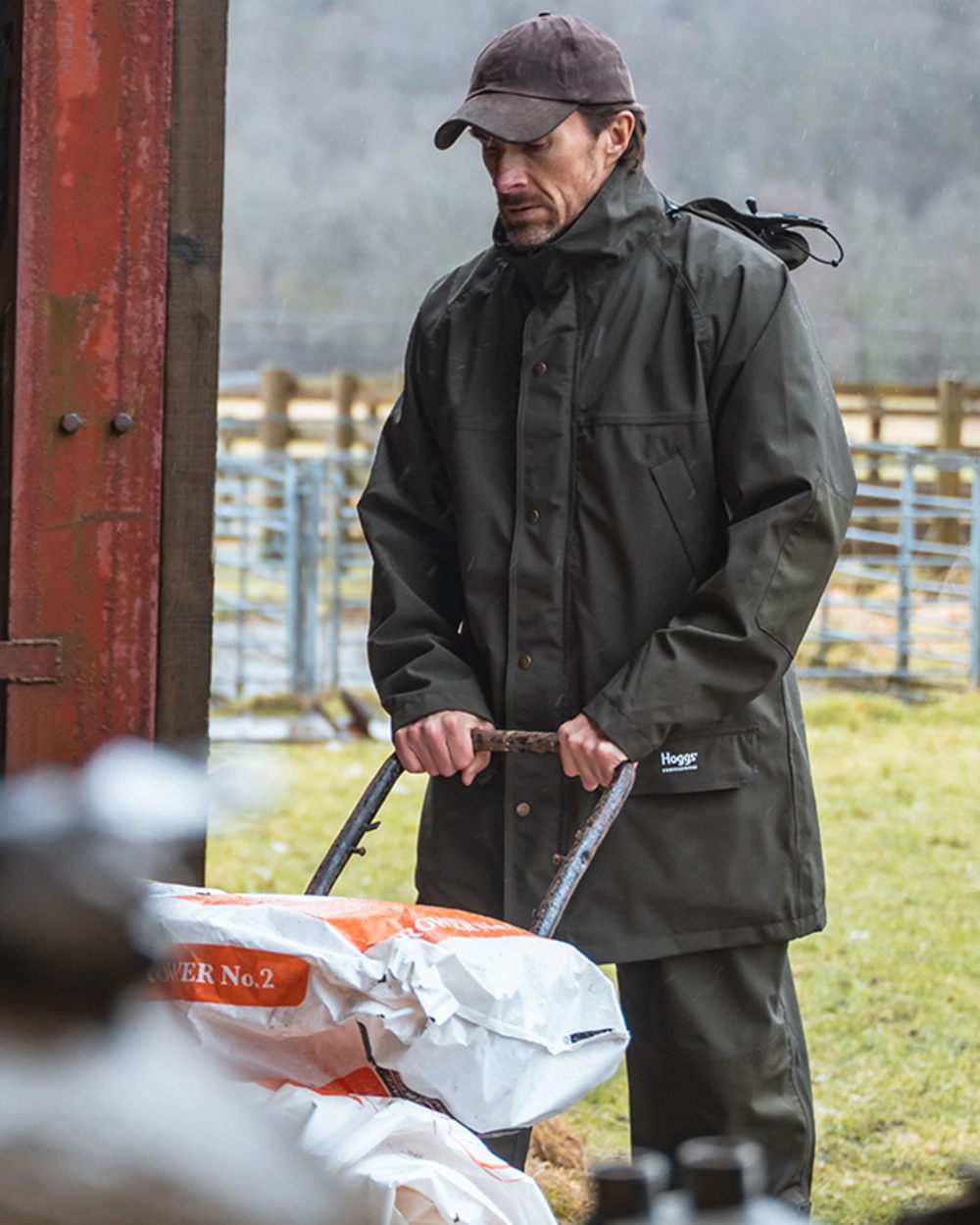 Green Coloured Hoggs of Fife Green King II Waterproof Jacket on outdoor background