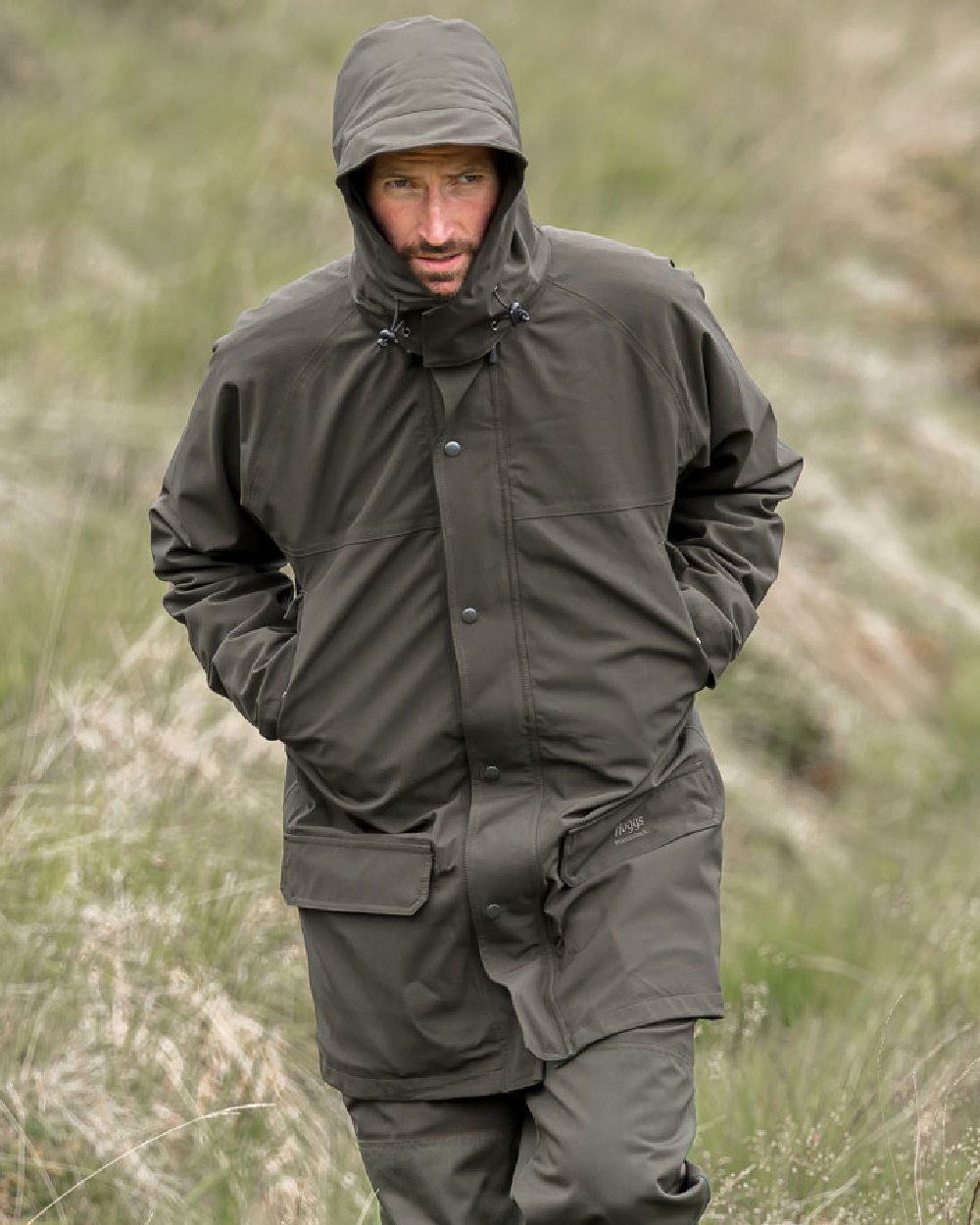 Green Coloured Hoggs of Fife Green King II Waterproof Jacket on grass background