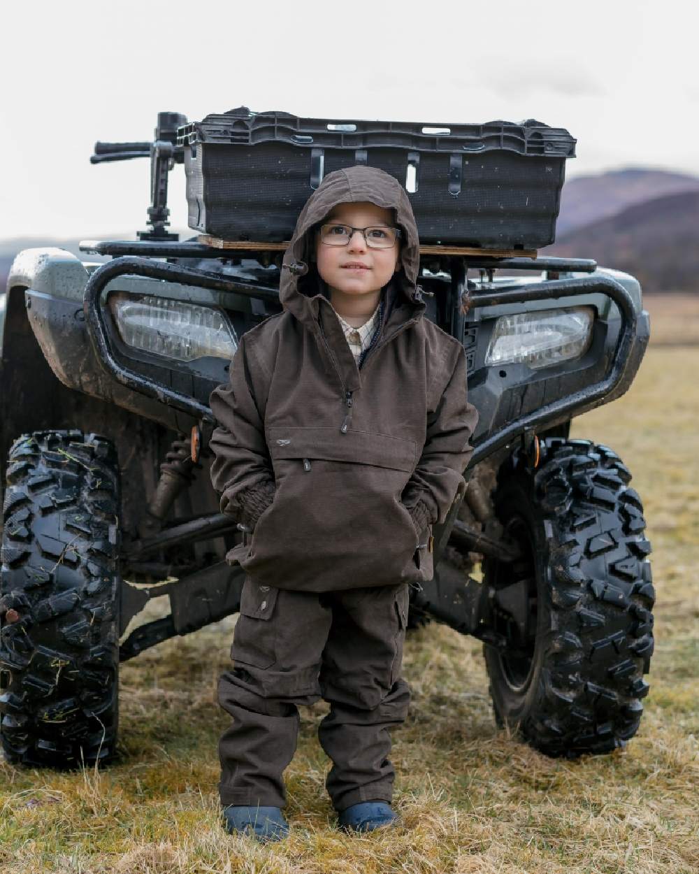 Dark Green Coloured Hoggs of Fife Junior Struther Waterproof Smock on tractor background