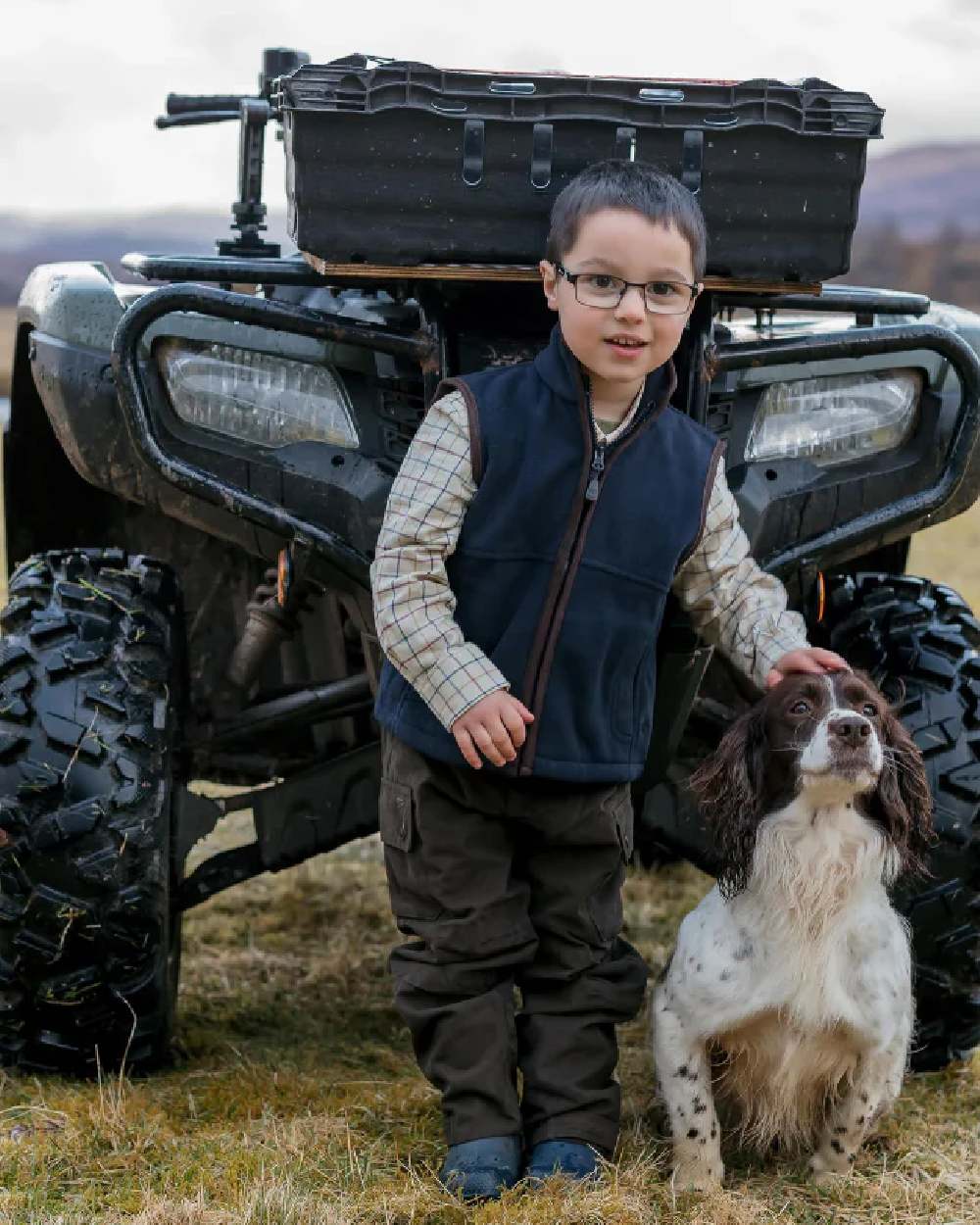 Navy Coloured Hoggs of Fife Junior Woodhall Fleece Gilet on tractor background
