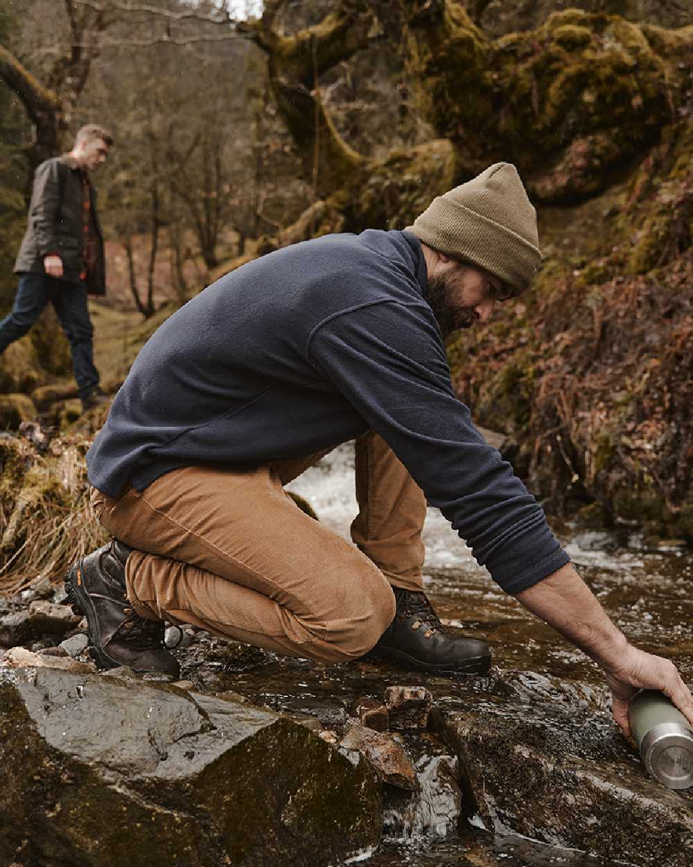 Olive coloured Hoggs of Fife Knitted Thinsulate Waterproof Beanie on mountain background