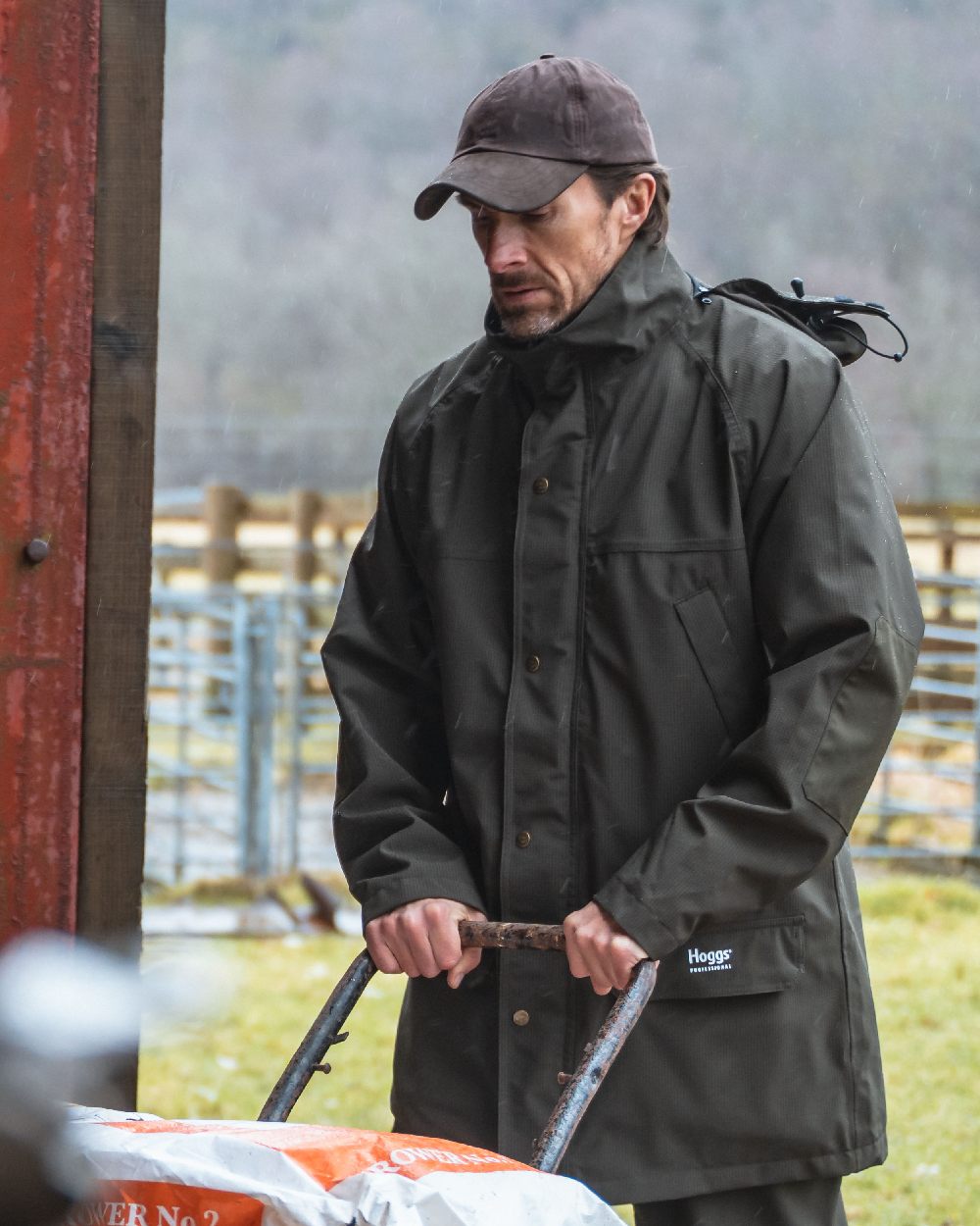 Brown Coloured Hoggs of Fife Leather Peak Waxed Baseball Cap on countryside background