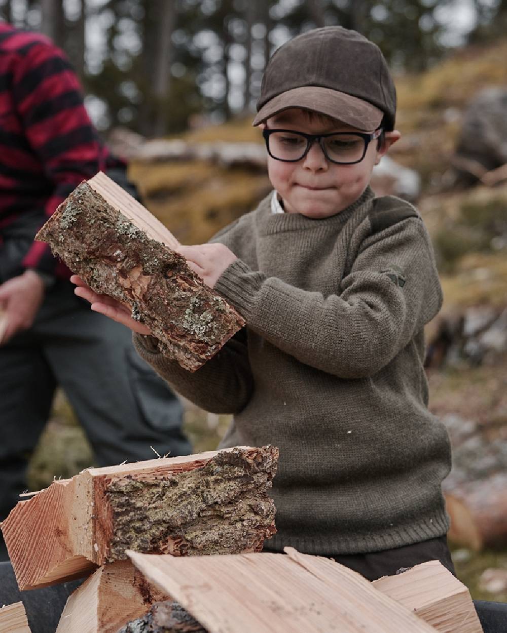 Meadow Green Marl Coloured Hoggs of Fife Melrose II Junior Hunting Pullover on forest background