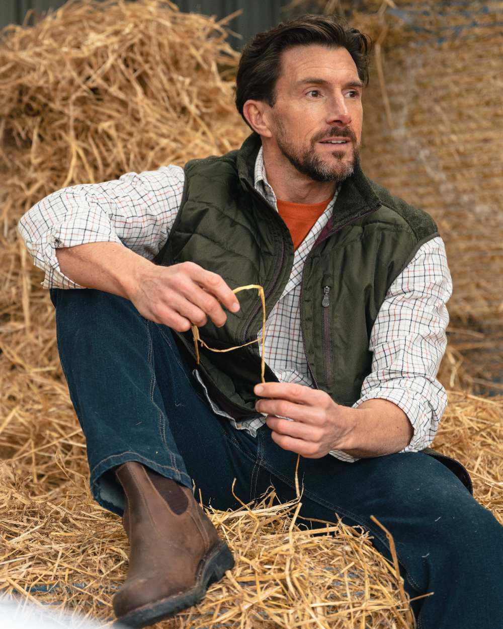 Dark Forest Marl Coloured Hoggs of Fife Mens Melville Hybrid Gilet on outdoor background