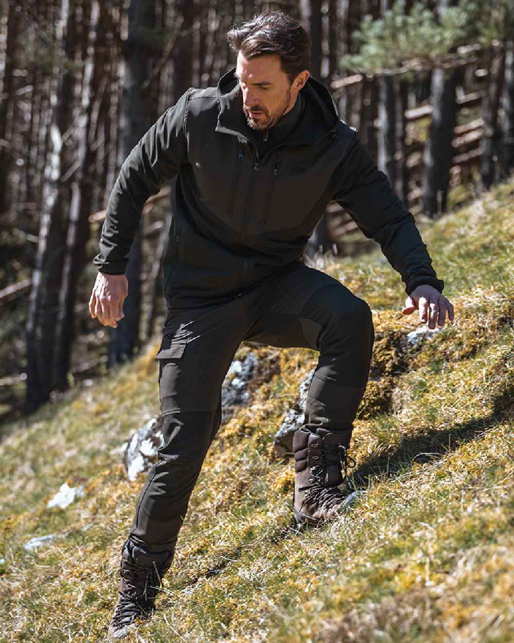 Green Coloured Hoggs of Fife Mens Ardross 4 Way Active Jacket on forest background