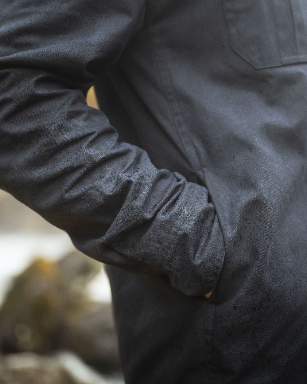 Midnight Navy Coloured Hoggs of Fife Mens Huntly Waxed Canvas Utility Overshirt on blurry background
