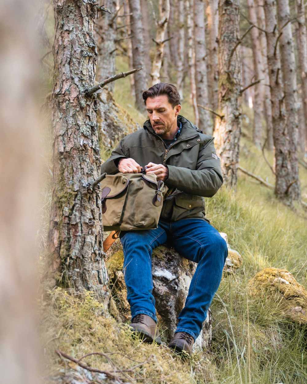 Forest Green Coloured Hoggs of Fife Mens Kelso Waterproof Wax Jacket on outdoor background