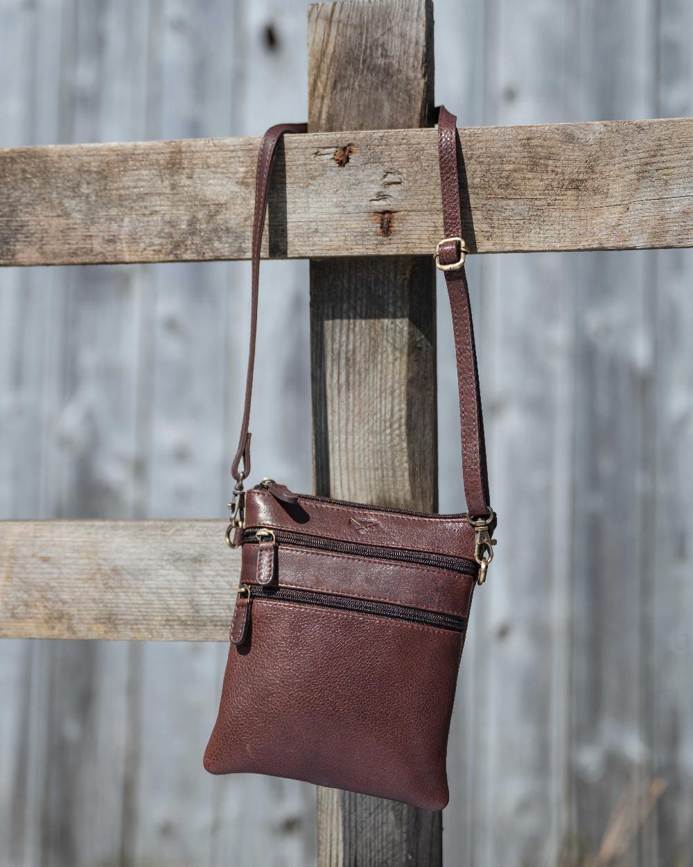 Conker Coloured Hoggs of Fife Monarch Leather Travel Organiser on outdoor background