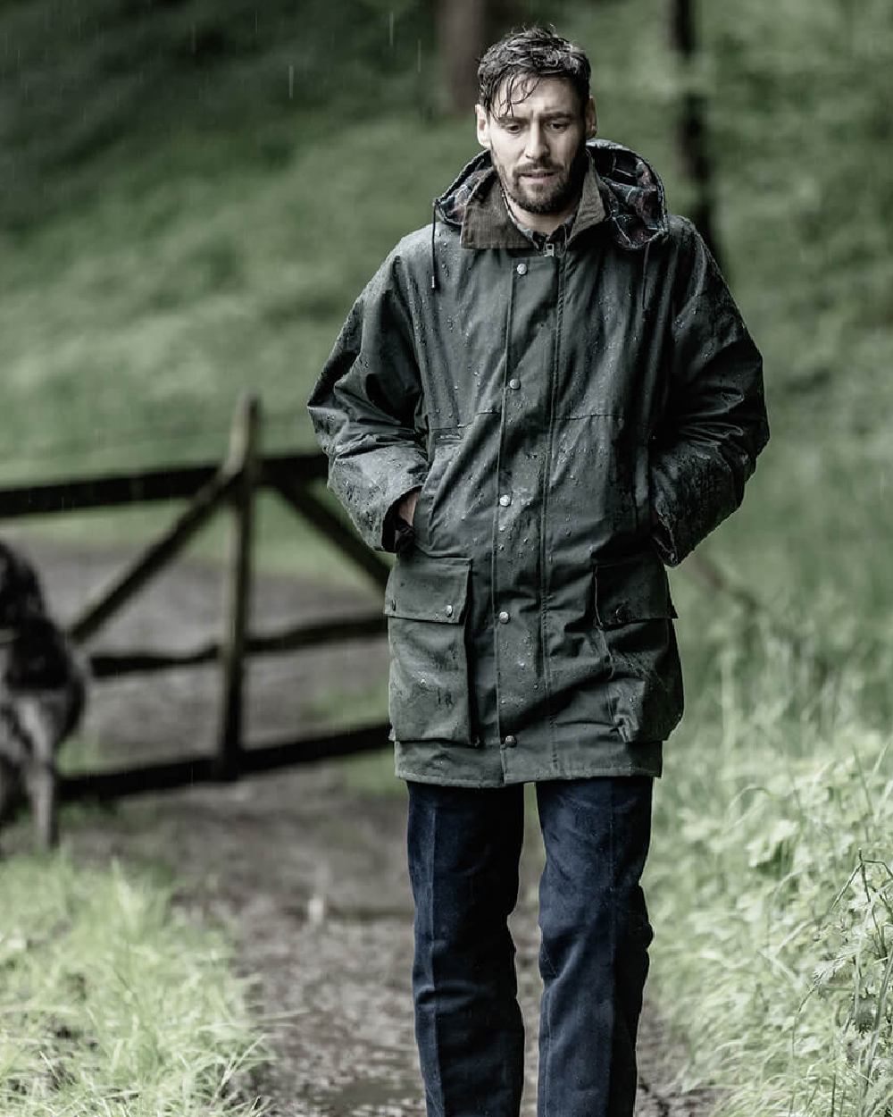 Olive Coloured Hoggs of Fife Padded Waxed Jacket on forest background