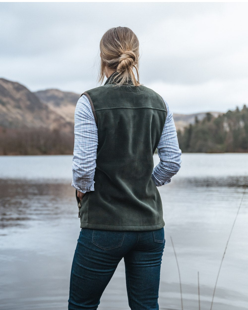 Pine Green Coloured Hoggs of Fife Stenton Ladies Fleece Gilet on lake background