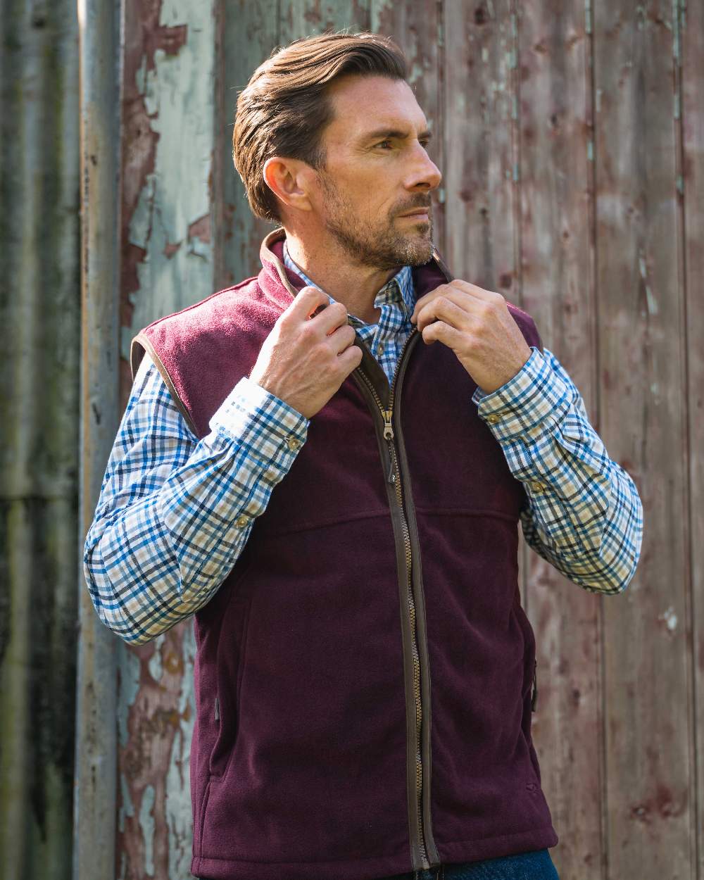 Merlot coloured Hoggs of Fife Stenton Technical Fleece Gilet on outdoor background