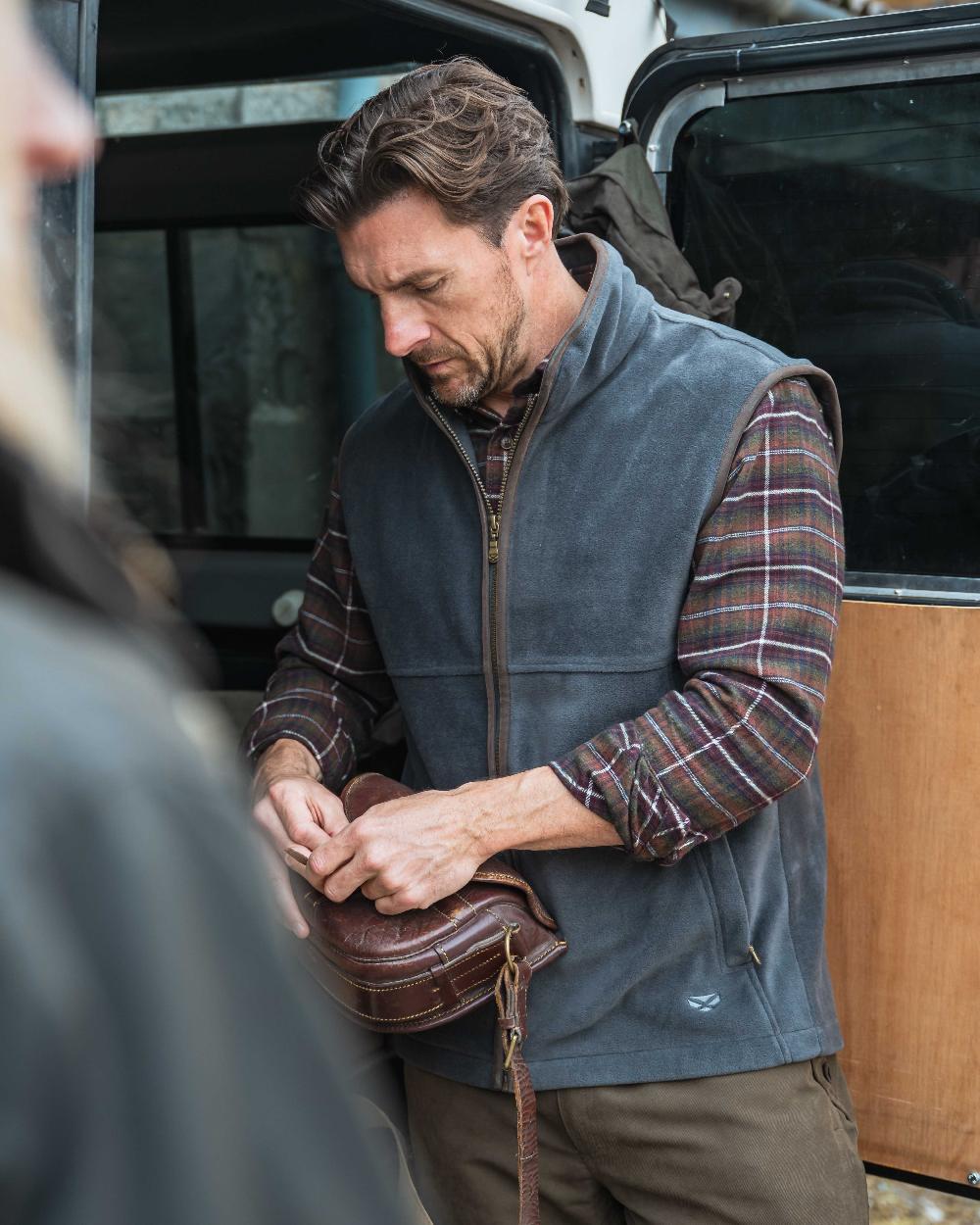 Slate Grey coloured Hoggs of Fife Stenton Technical Fleece Gilet on outdoor background
