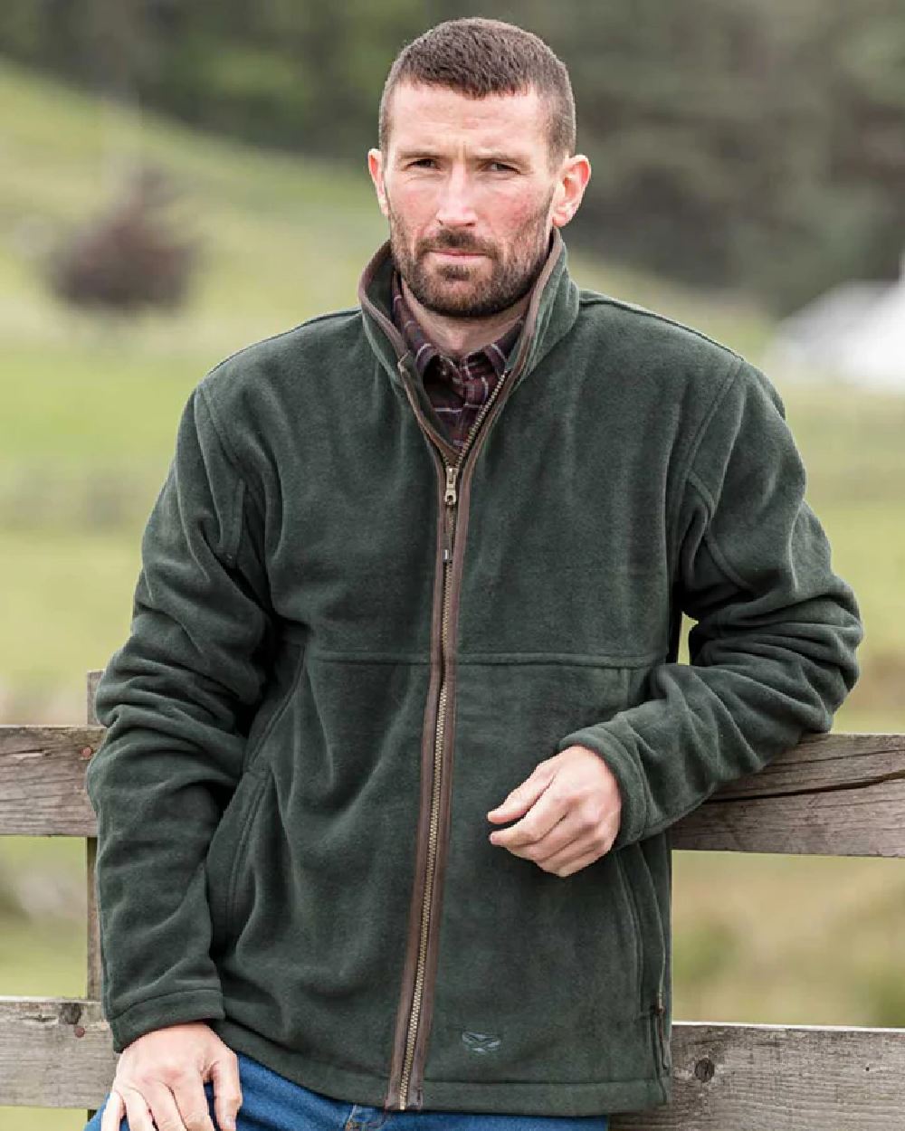 Pine Green Coloured Hoggs of Fife Stenton Technical Fleece Jacket on blurry background