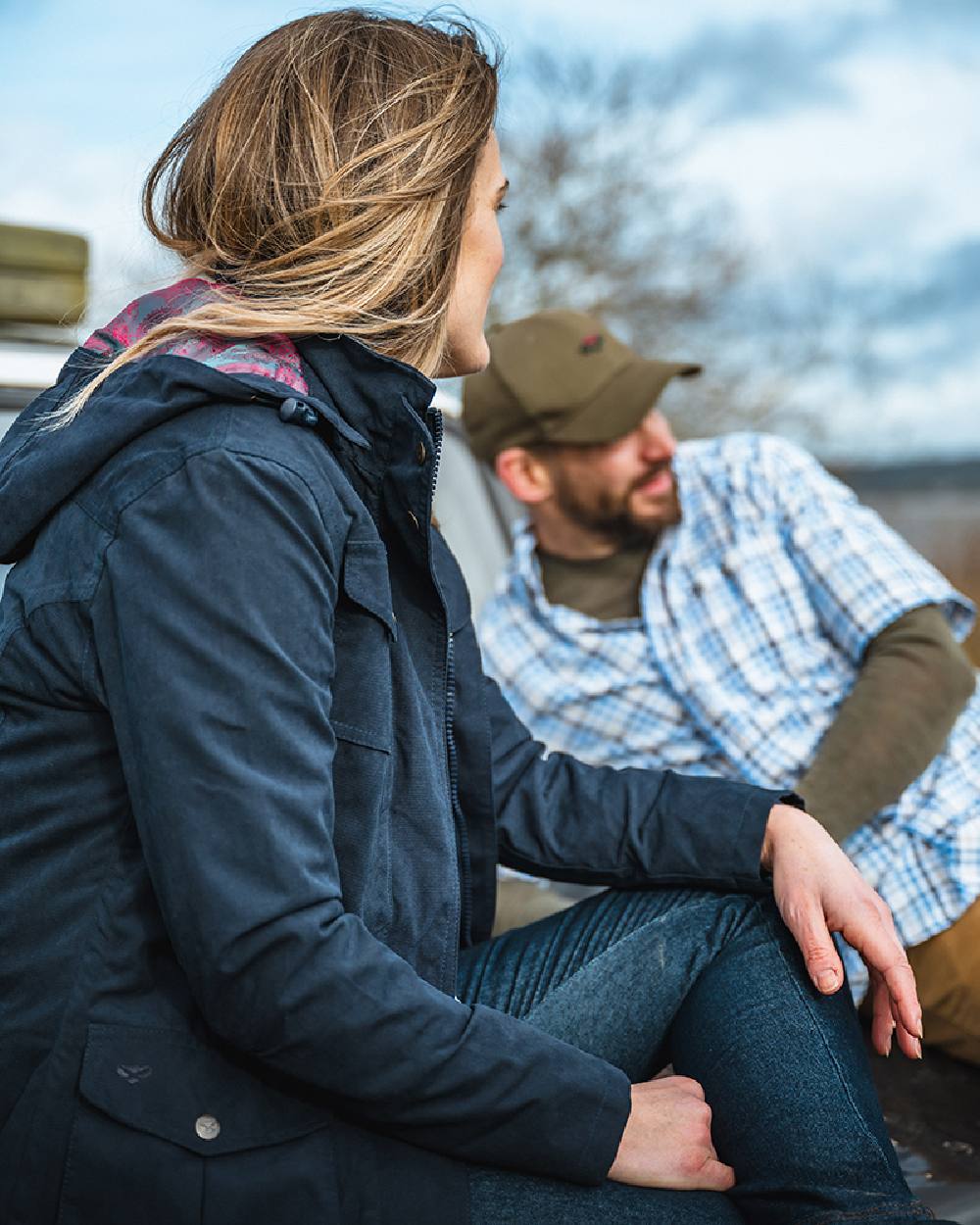 Navy Coloured Hoggs of Fife Struther Ladies Hooded Field Coat on blurry background
