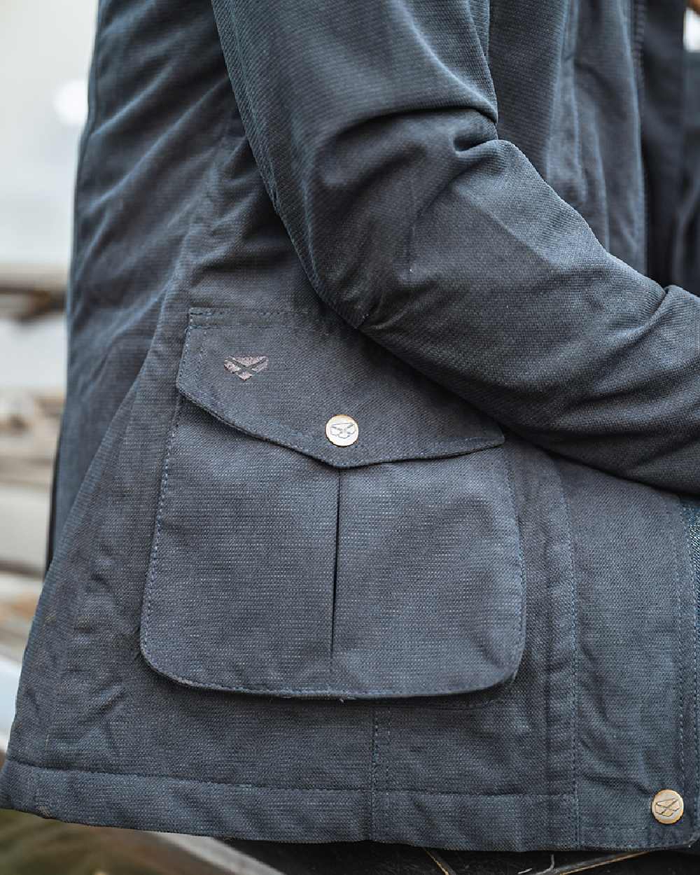 Navy Coloured Hoggs of Fife Struther Ladies Hooded Field Coat on blurry background