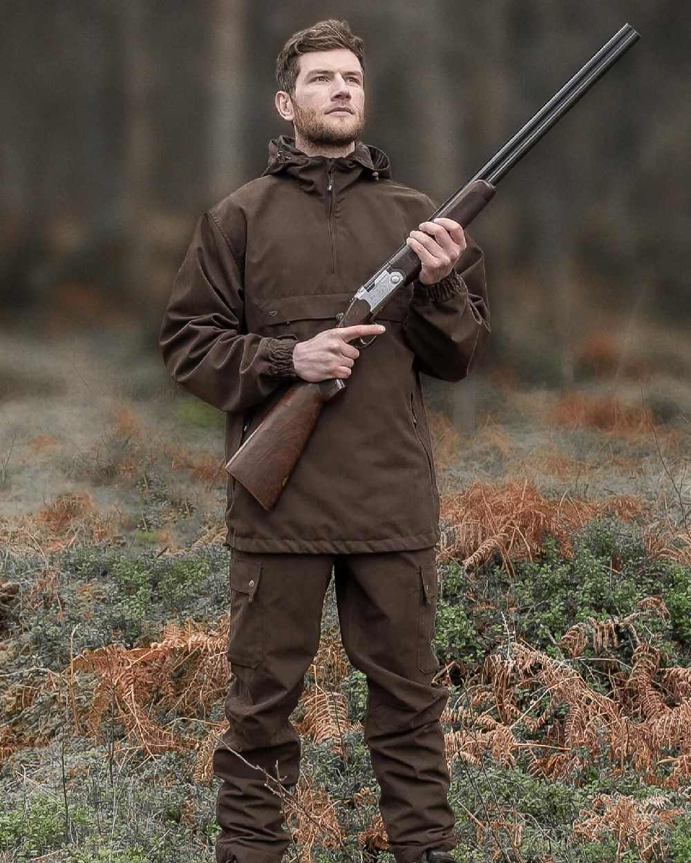 Dark Green coloured Hoggs of Fife Struther Waterproof Smock Jacket on forest background