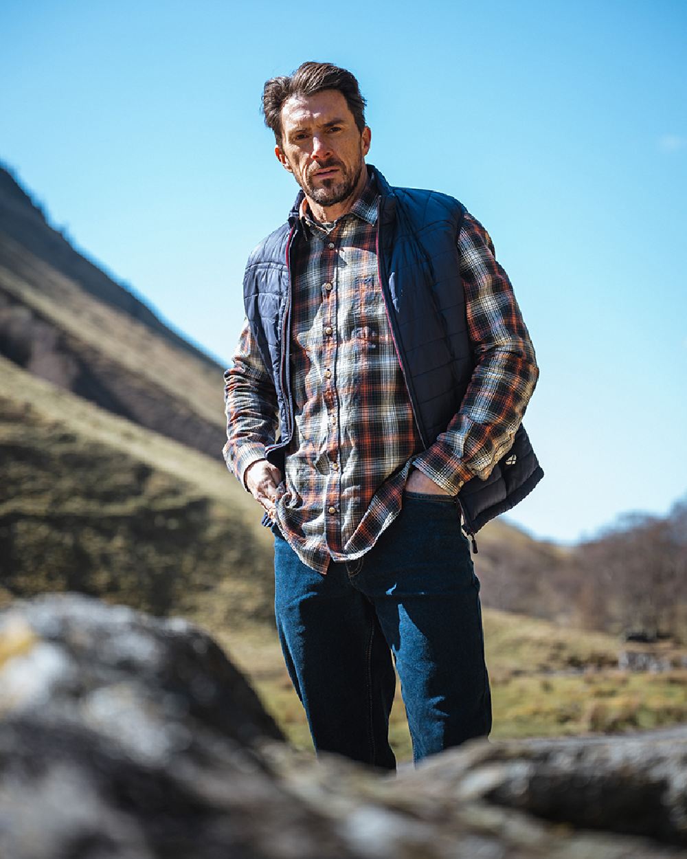 Rust Olive Navy coloured Hoggs of Fife Tiree Herringbone Check Shirt on mountain background