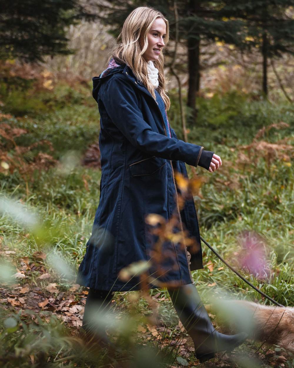 Navy coloured Hoggs of Fife Womens Walker Long Coat on forest background