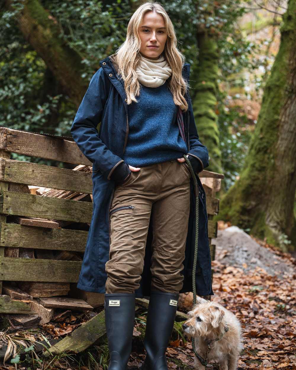 Navy coloured Hoggs of Fife Womens Walker Long Coat on forest background