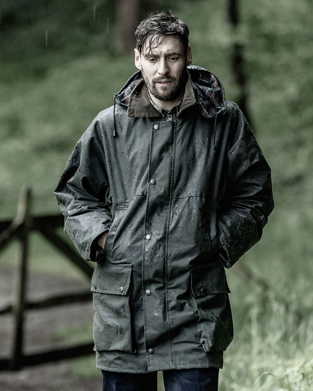 Olive Coloured Hoggs of Fife Woodsman Waxed Jacket on forest background