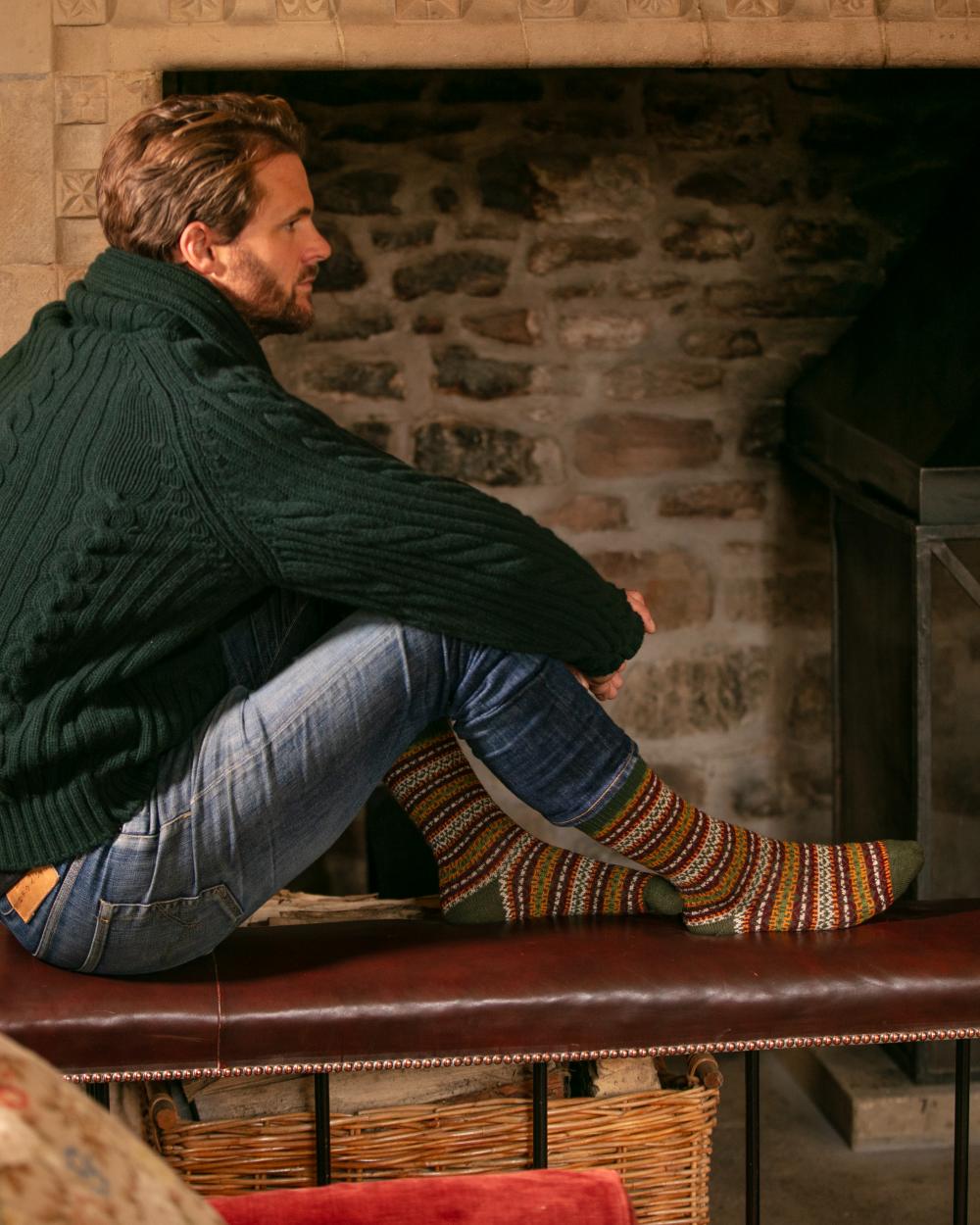 Spruce coloured House of Cheviot Fairsle Short Socks on house background