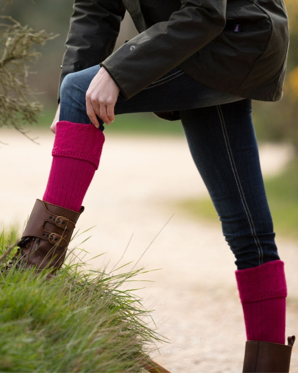 Fuchsia coloured House of Cheviot Lady Glenmore Socks on blurry background