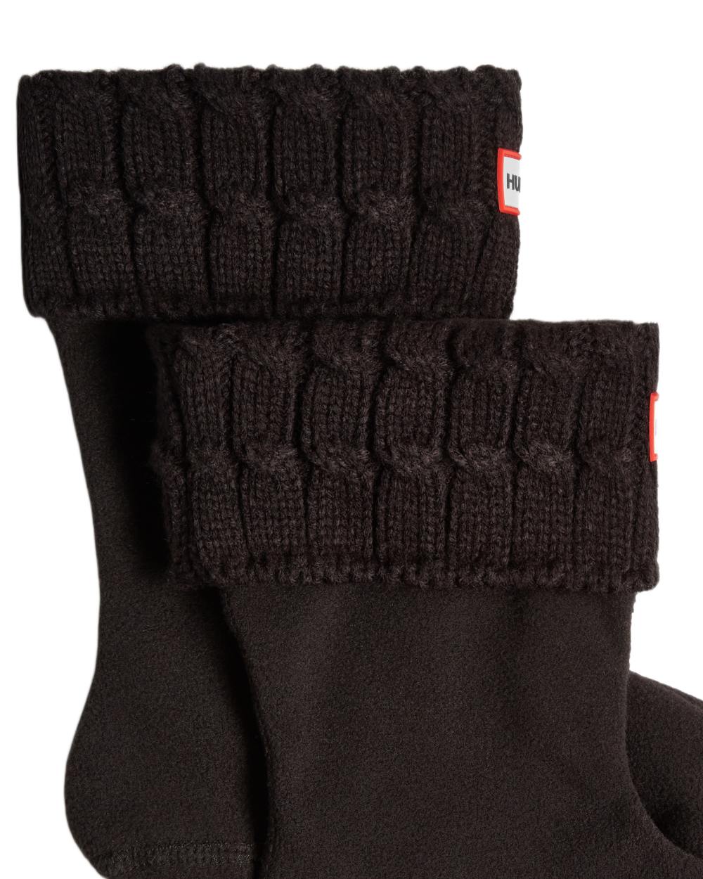 Black coloured Hunter Recycled 6 Stitch Cable Cuff Short Boot Socks on white background