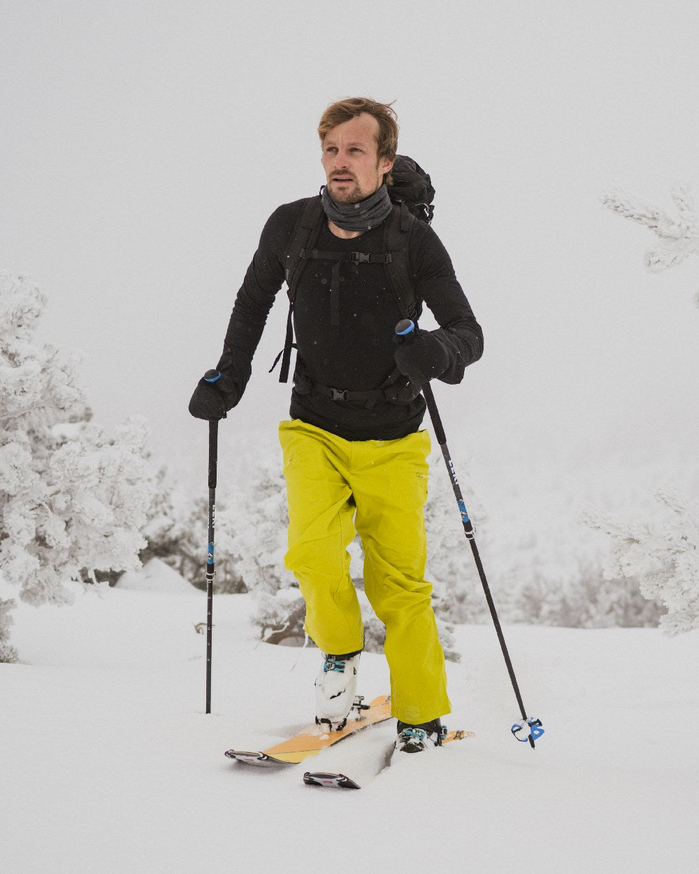 Black Coloured Icebreaker Mens Merino 200 Oasis Crewe Thermal Top on snow background