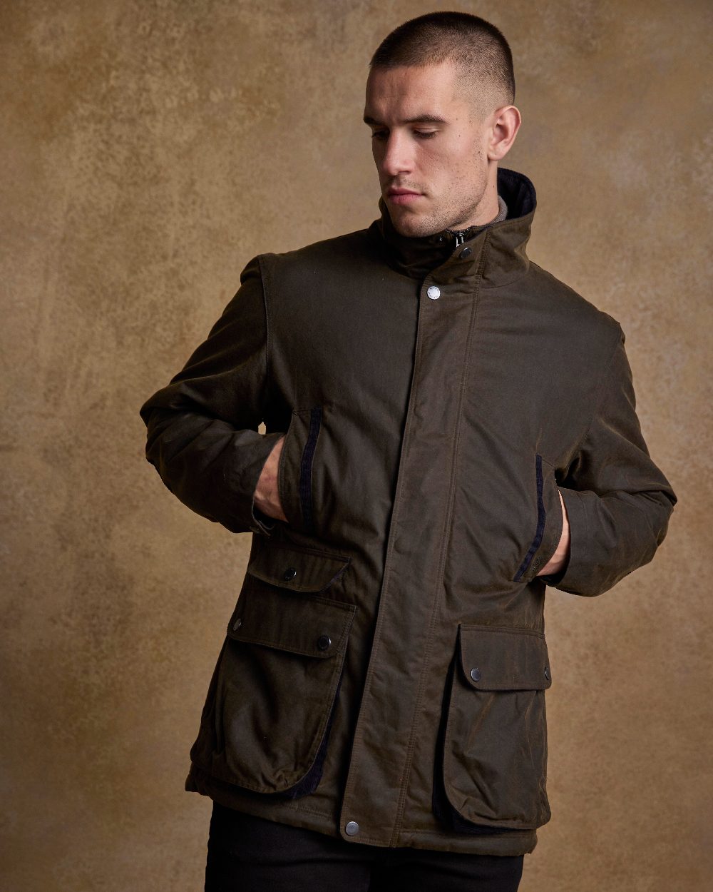 Olive Coloured Jack Murphy Archie Wax Jacket on indoor background