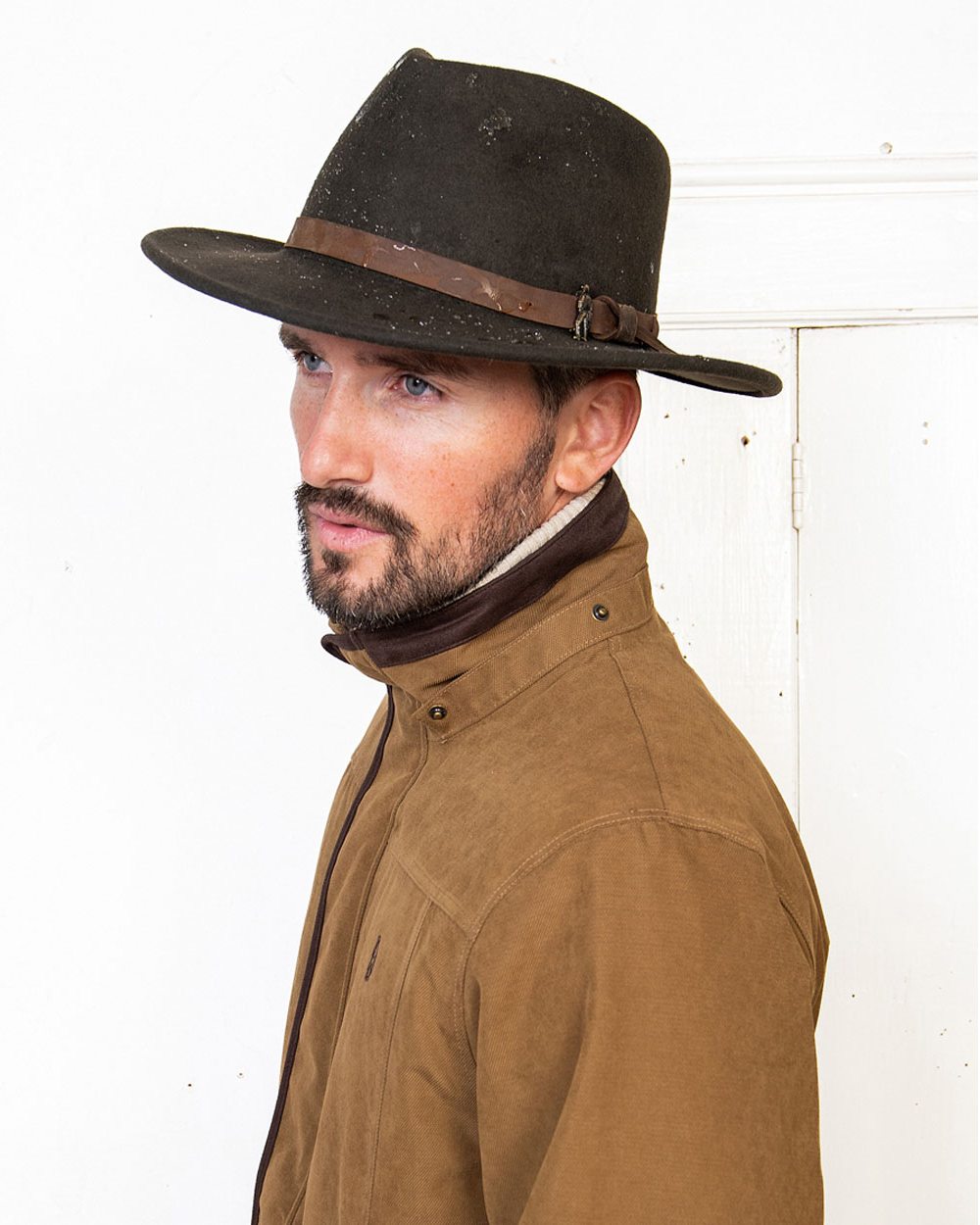 Brown coloured Jack Murphy Boston Crushable Felt Hat on wall background