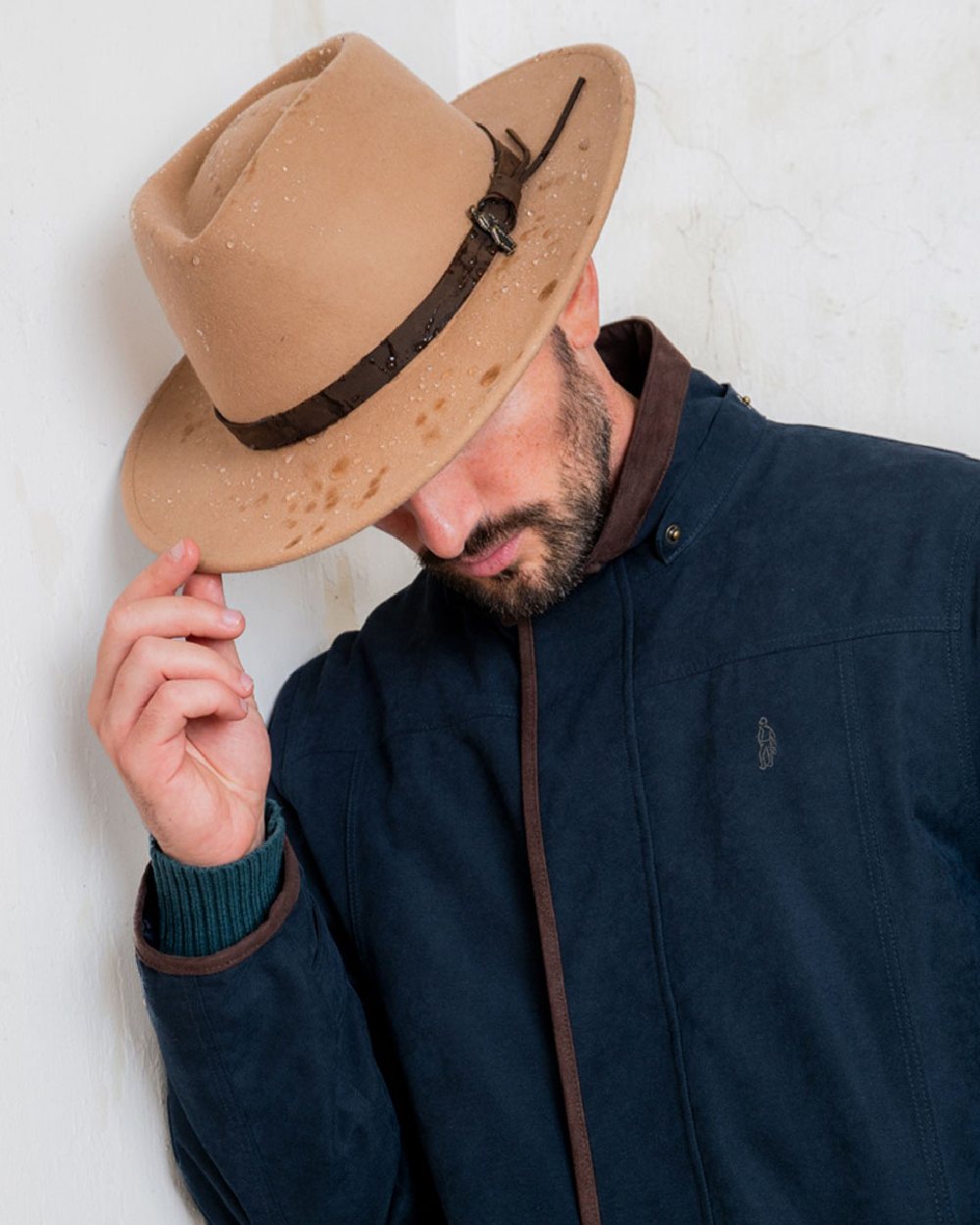 Tan coloured Jack Murphy Boston Crushable Felt Hat on wall background
