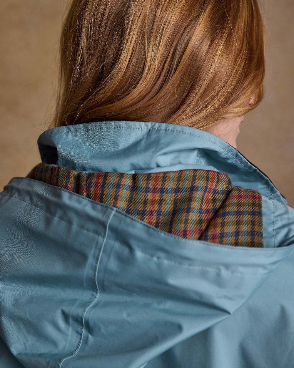 Smoke Blue Coloured Jack Murphy Cotswold Ladies Waterproof 3/4 Coat on indoor background